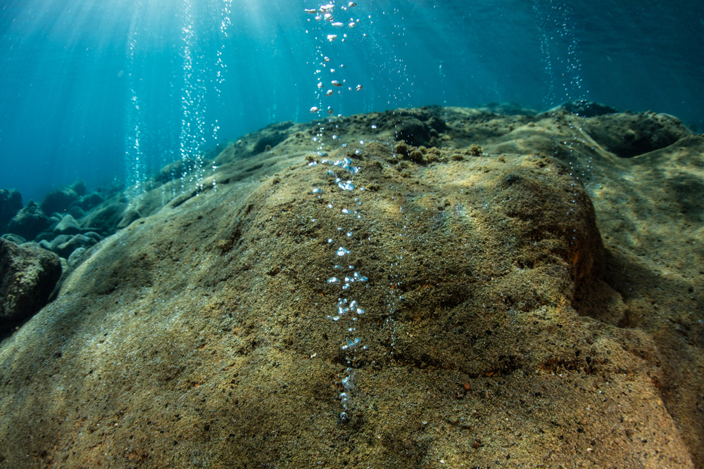 Bubbles rise from the seafloor near an active volcano in the Lesser Sunda Islands of Indonesia. This region is part of the Ring of Fire.