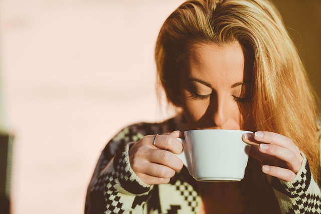 woman drinking a cup of coffee