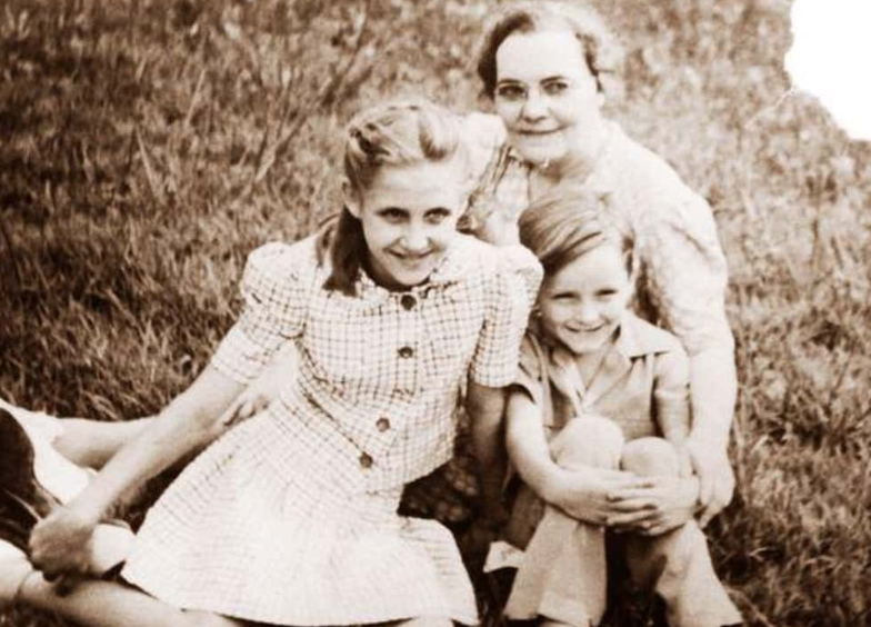 a happy young Charles, Kathleen, and her mother