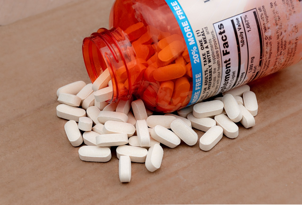 a spilled container of multivitamins