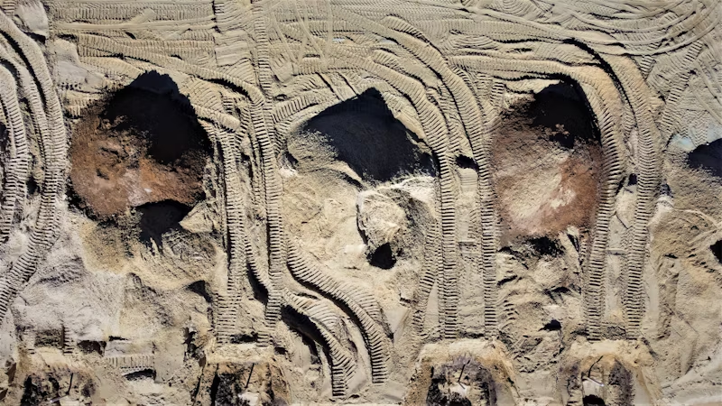tire tracks and holes dug