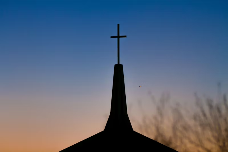 a cross on a church roof