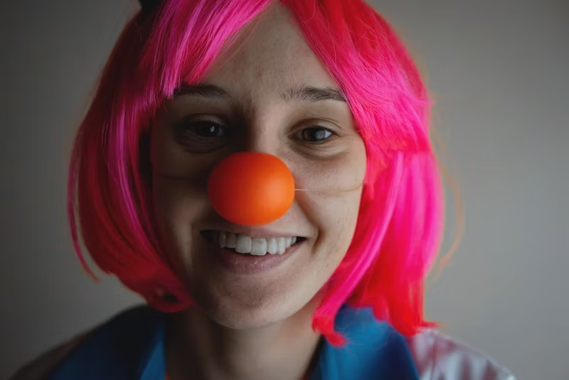 woman wearing a clown nose
