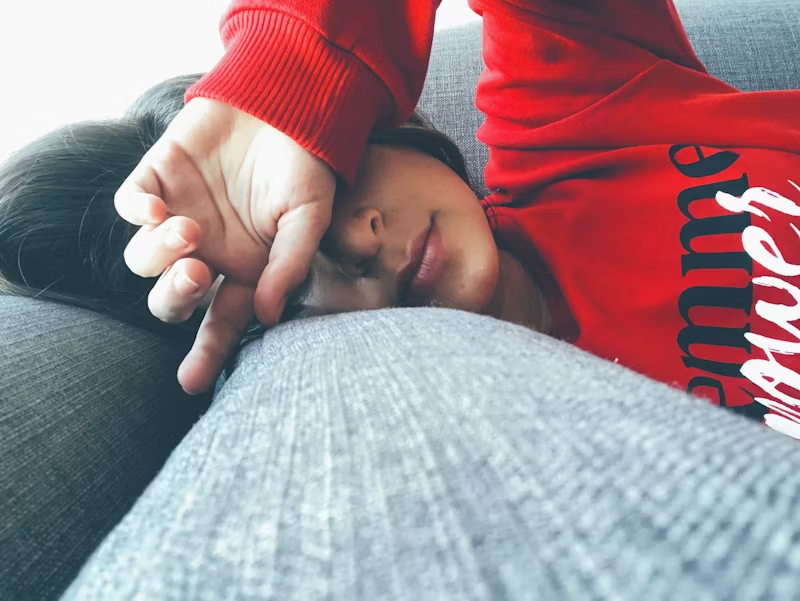 woman laying on a couch