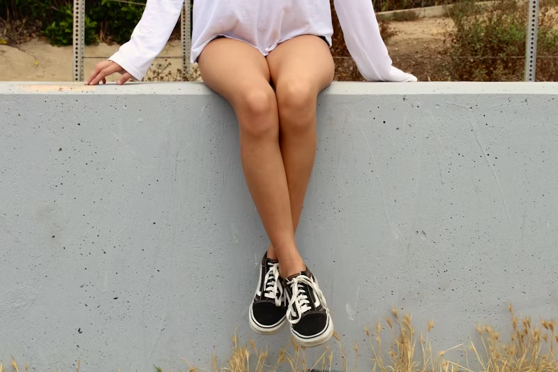 woman sitting with legs crossed