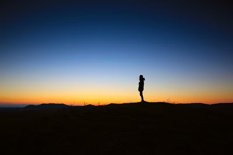 one person's silhouette against the sunset