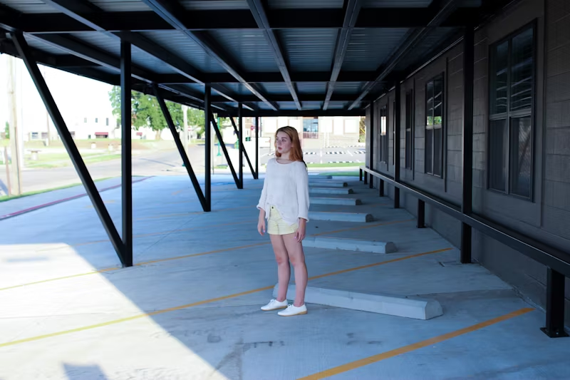 girl standing in the shade