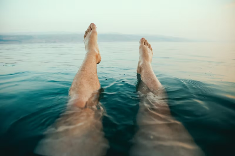 legs raised in water