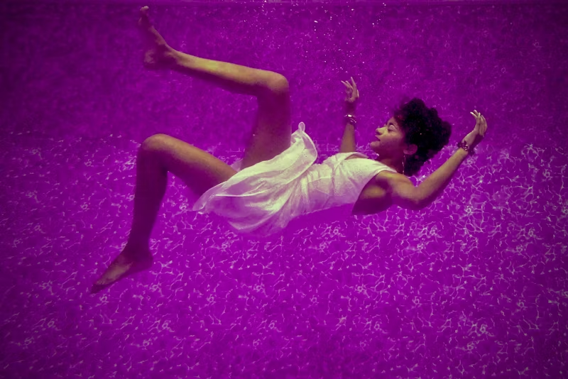 person floating in purple