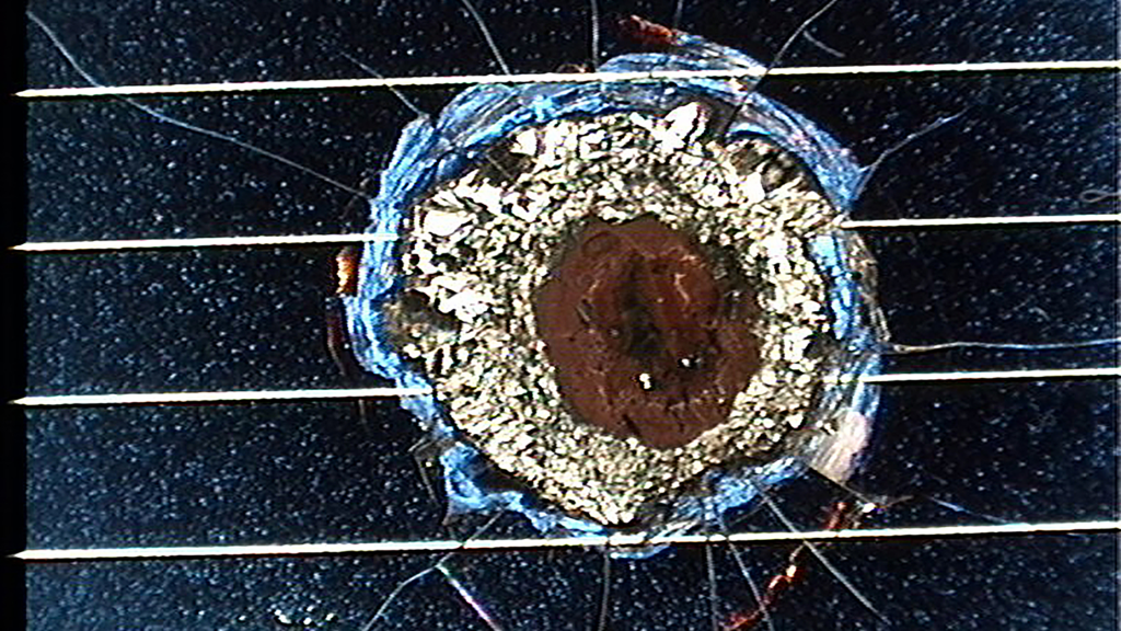 Today, many spacecraft experience some form of collision with micrometeoroids or minute pieces of debris. These solar cells from the Hubble Space Telescope, installed in 1993 and brought back to Earth by NASA astronauts in 2002, experienced multiple impacts during their nearly nine years on orbit.