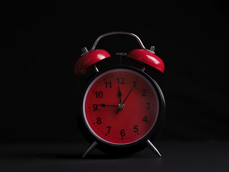 red and black alarm clock