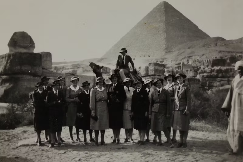 group of ladies in black and white at the pyramids