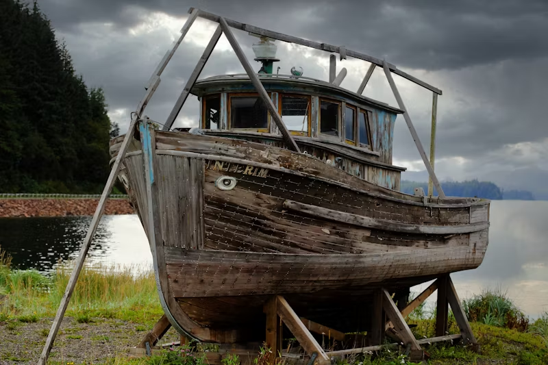 a small wooden boat ashore