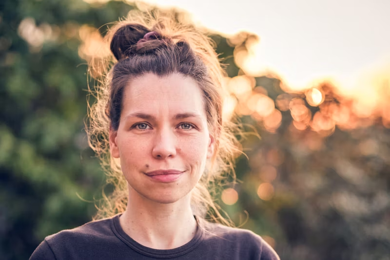 a woman subtly smiling