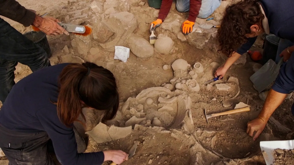 Removing the ancient tools from the ground.