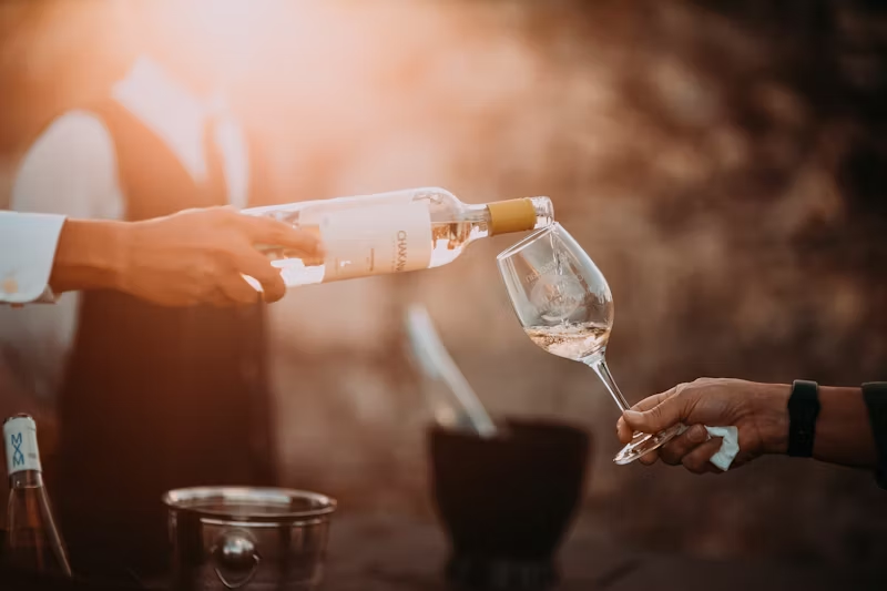 a glass of wine being poured