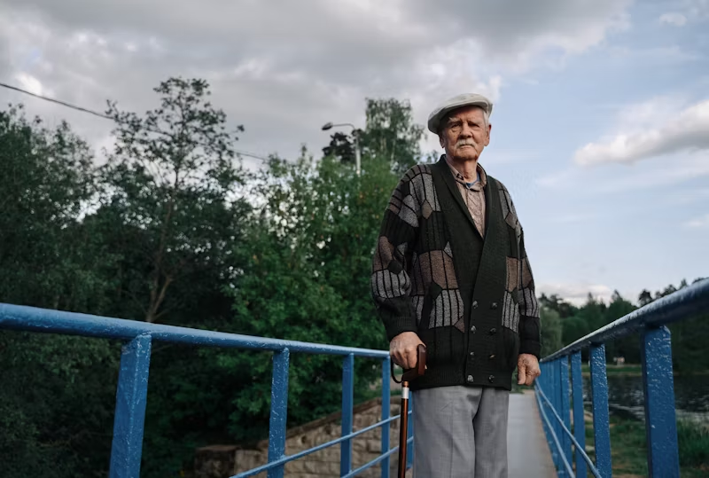 an elderly man with a walker