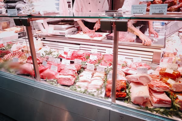 assorted deli meats behind a counter
