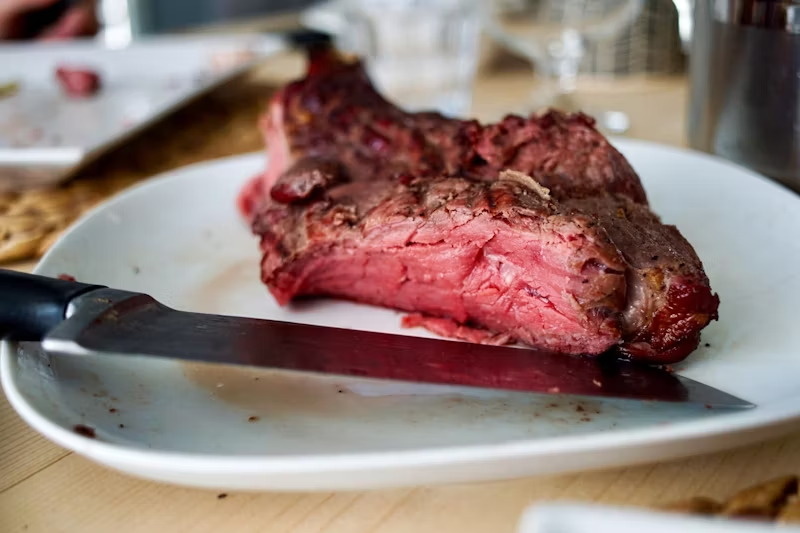 a large piece of red meat