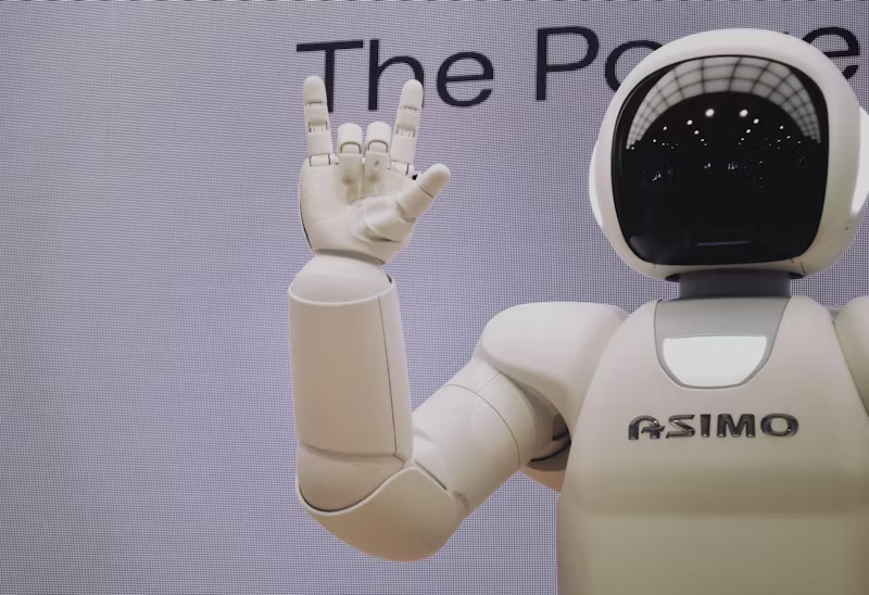 a robot making the rock symbol