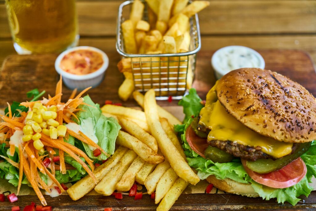 juicy burger, fries, salad 