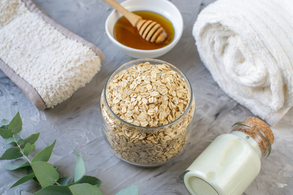 Natural Ingredients Homemade Body Oatmeal Sea Salt Scrub with Olive Oil Honey Milk White Towel Beauty Concept Skincare Organic Aroma Spa Therapy
