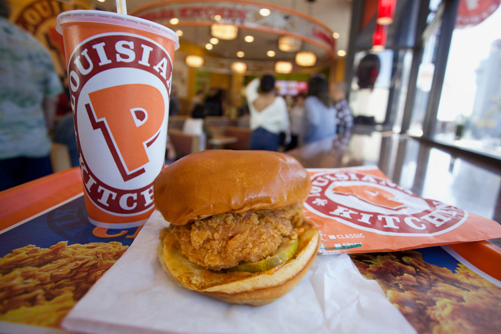 Los Angeles - November 8, 2019: Popeyes Spicy Chicken Sandwich with customers in background
