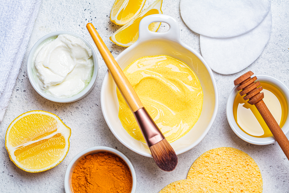 Preparation of turmeric face mask with honey and yogurt.

