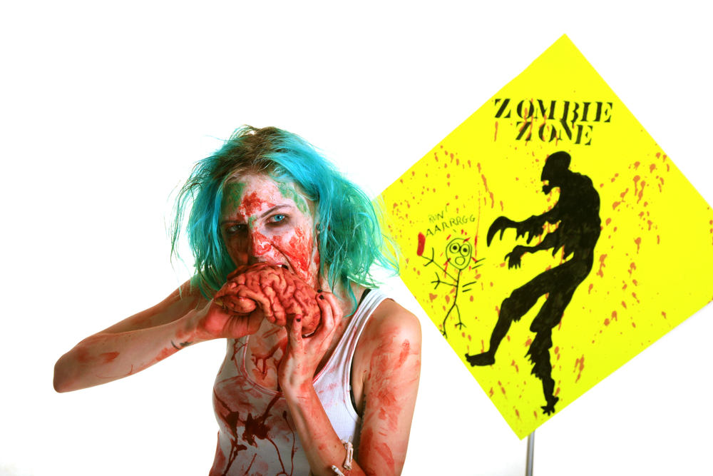 A genuine Female Zombie enjoys eating a Fresh Brain from her latest Victim. Zombies are currently the most popular monster in the entertainment field, even more than Vampires, Mummies, Aliens etc.
