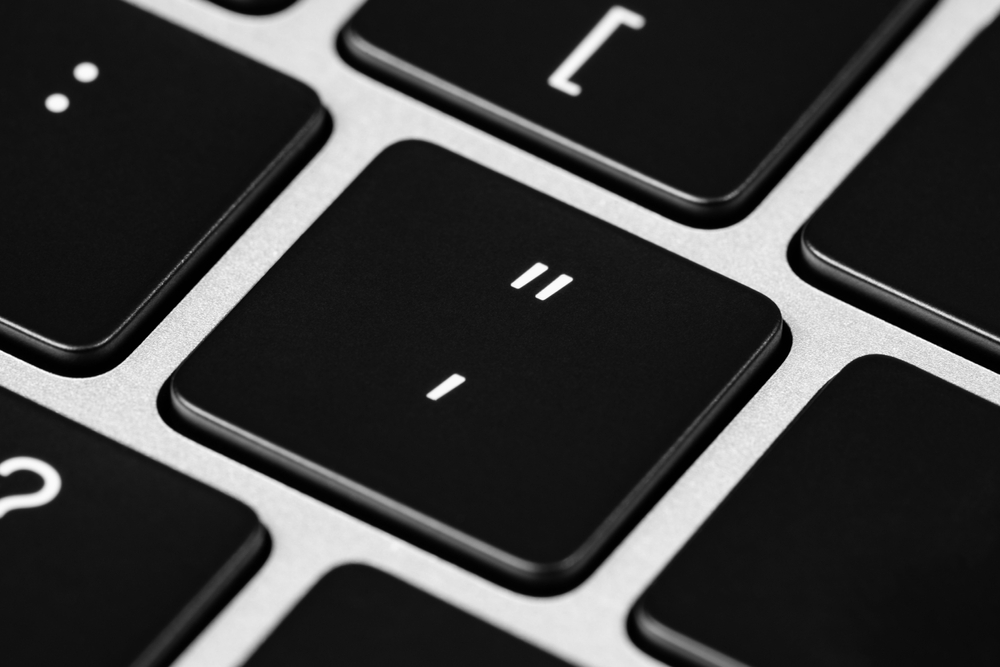 Close up image of a "quotation mark" and "apostrophe" key on a keyboard