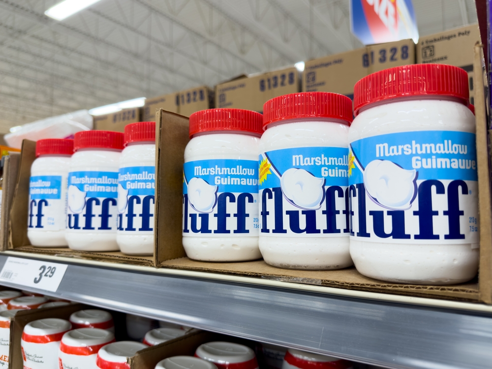 Winnipeg, Manitoba, Canada - 05-08-2023: A view of several containers of Marshmallow Fluff creme, on display at a local grocery store.
