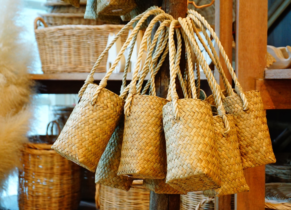 Bamboo baskets, crafted with skill and cultural significance, are handmade containers in a rich brown hue, showcasing the artistry of traditional craftsmanship.
