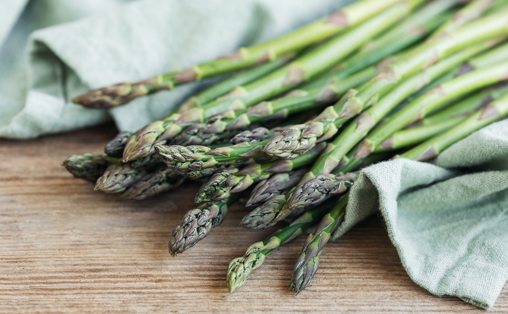 Bunches of green raw garden asparagus.