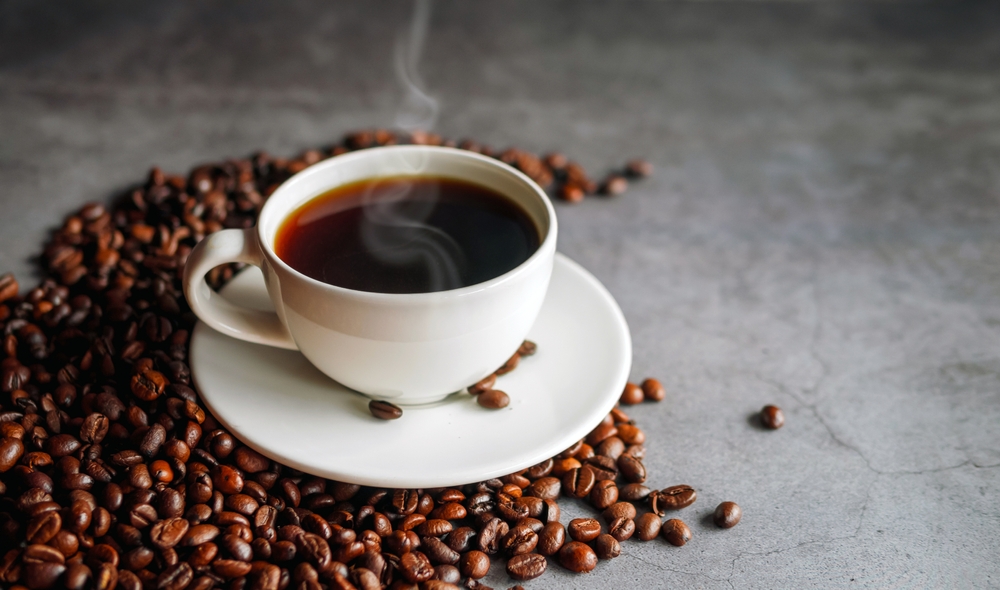 Coffee cup and coffee beans on gray background, Black coffee cup aromatic