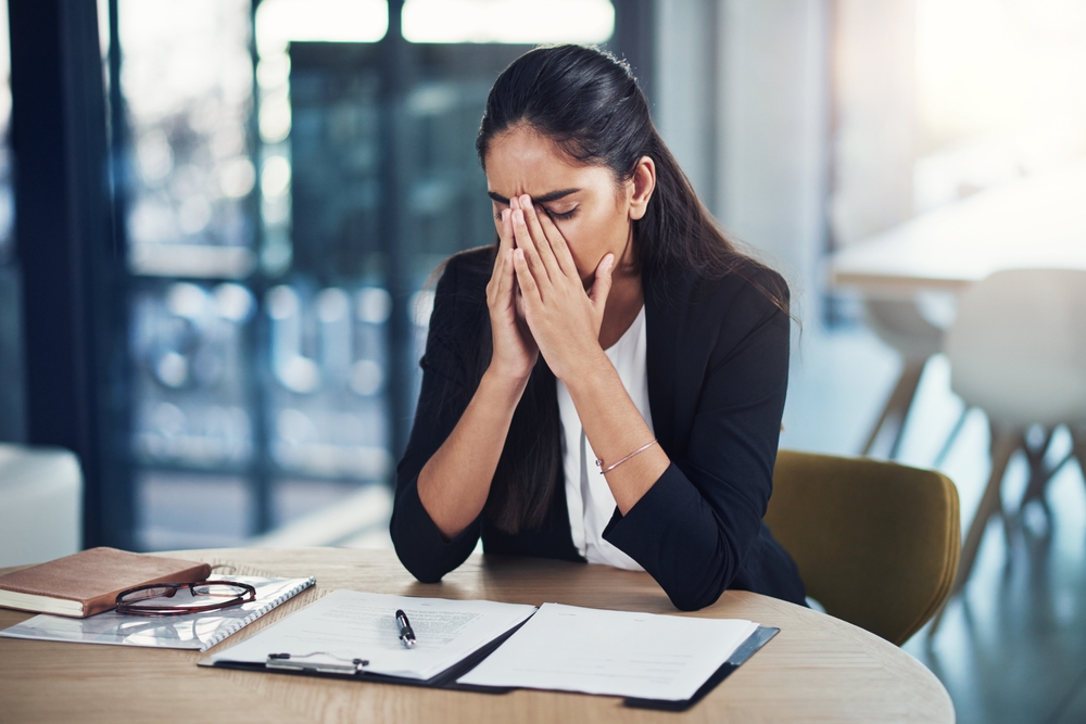 Business woman, paperwork and lawyer with stress for contract mistake, policy fail and burnout in office. Female attorney, frustrated and insurance form for bankruptcy, crisis and anxiety at law firm