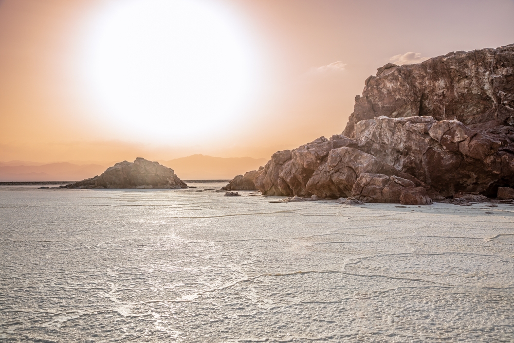Karum white salt lake surface at the sunser time, Danakil Depression desert, Afar region, Ethiopia
