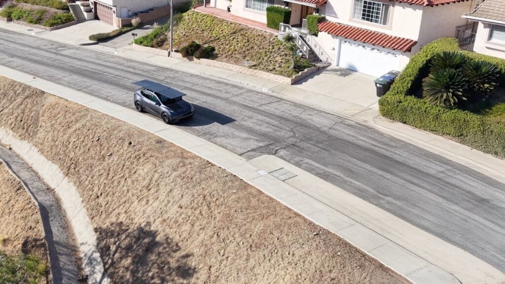 An EV equipped with DartSolar solar roof on the road