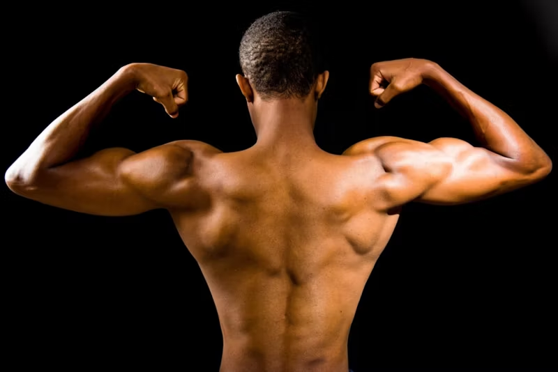 a man flexing from behind