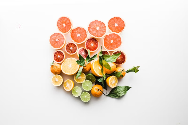 assorted citrus fruits sliced in half