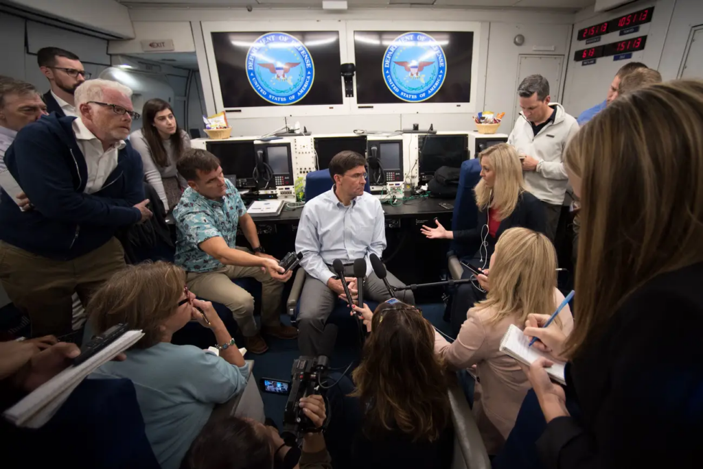 Then-Secretary of Defense Mark T. Esper met with reporters on board an E-4B in 2019. 