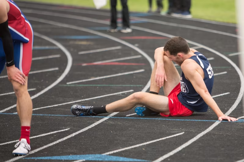 a track athlete trying to catch their breath