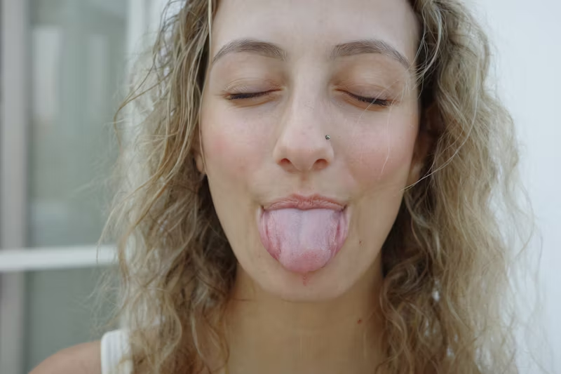 a woman with her tongue sticking out