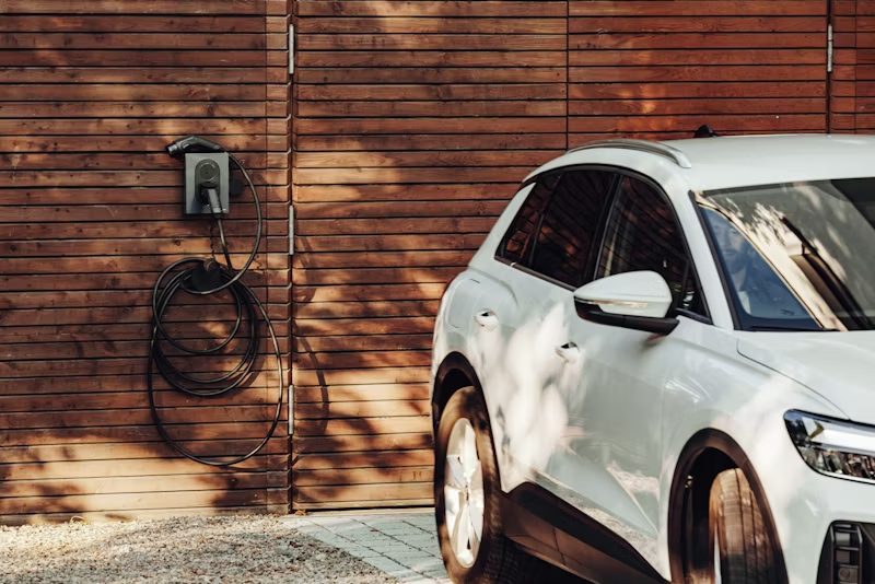 electric vehicle parked at a house gate