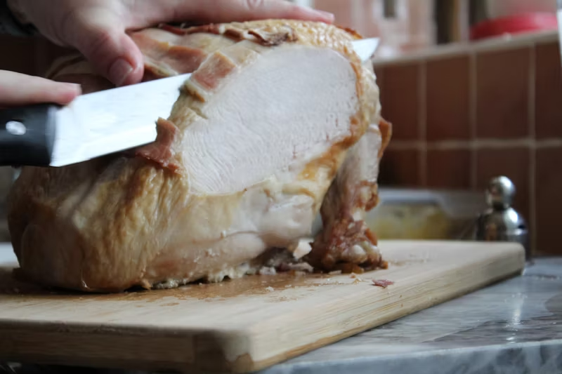 turkey meat being sliced