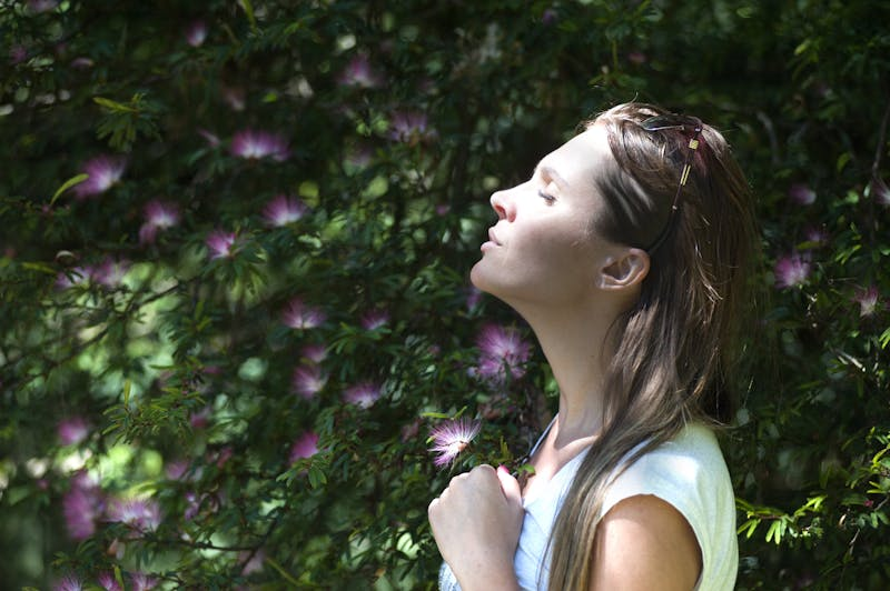 woman breathing outside