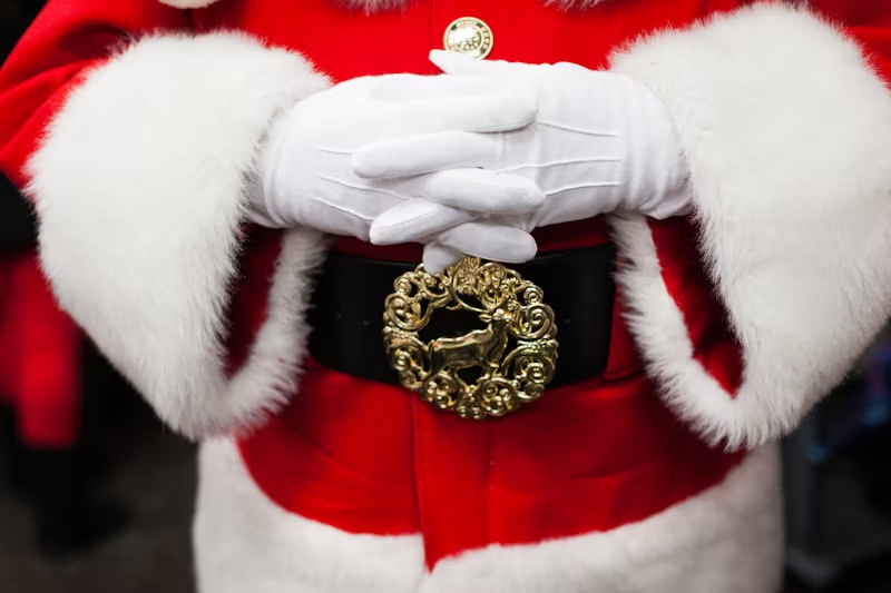 Santa with his hands crossed over his front