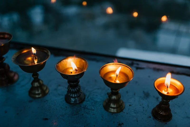 candles at different levels of burning and brightness