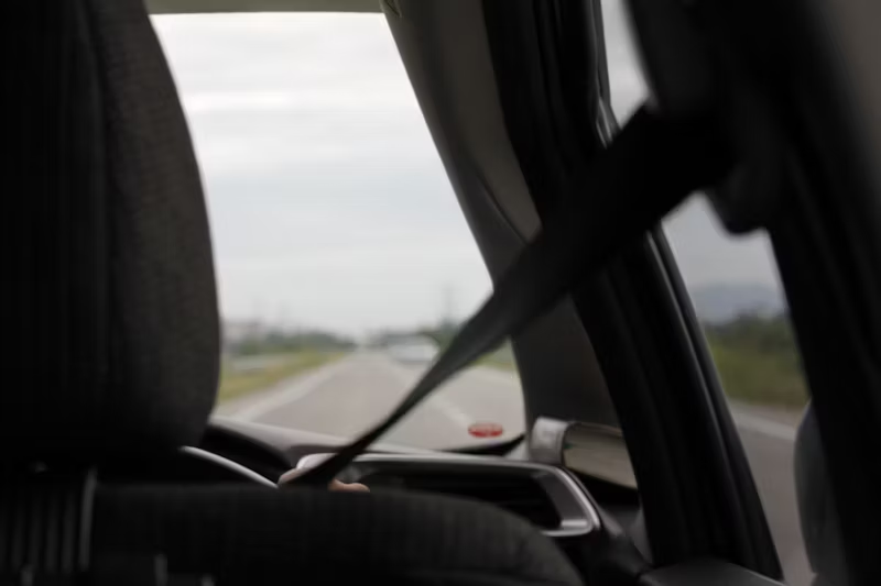 POV of the road from the back of a car