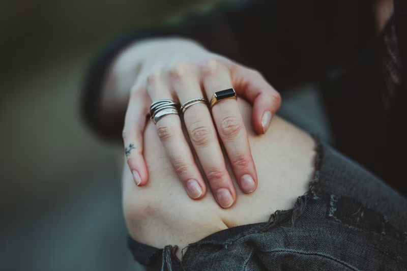 a person holding onto their knee