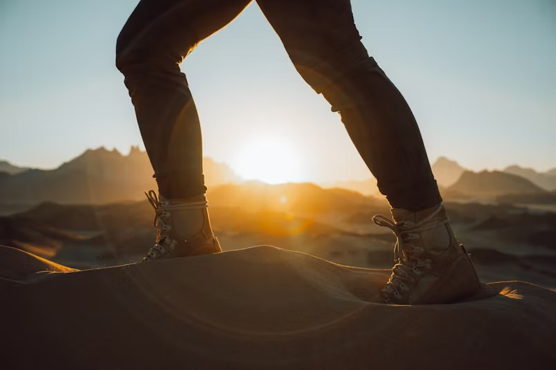 a person walking through sand